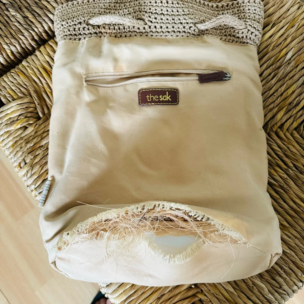 The Sak crochet drawstring backpack with zip pocket